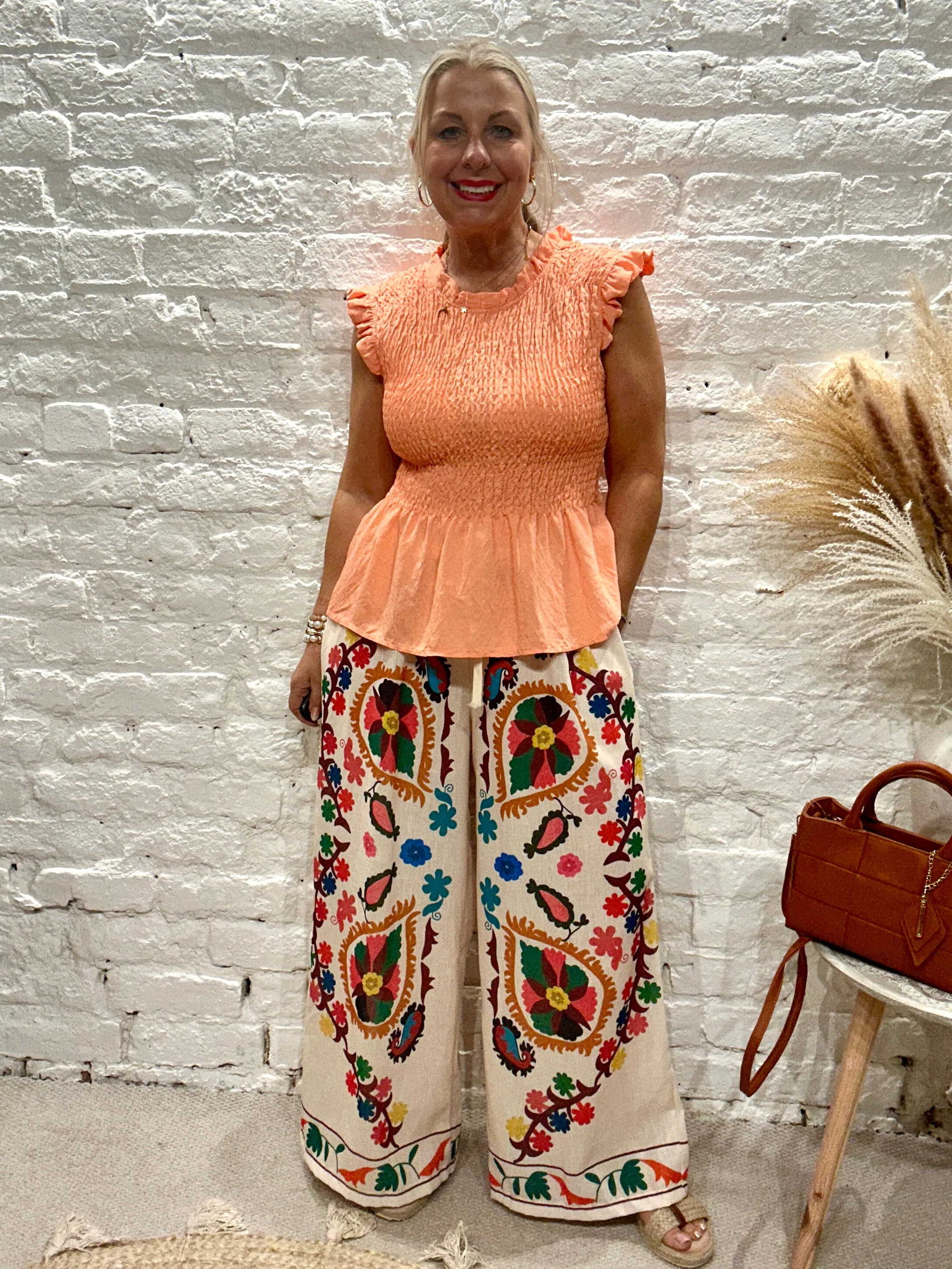 Romantica Sheering Peplum Top