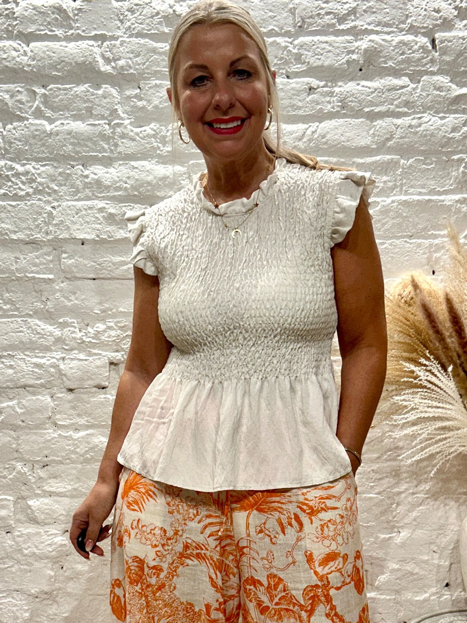Romantica Sheering Peplum Top