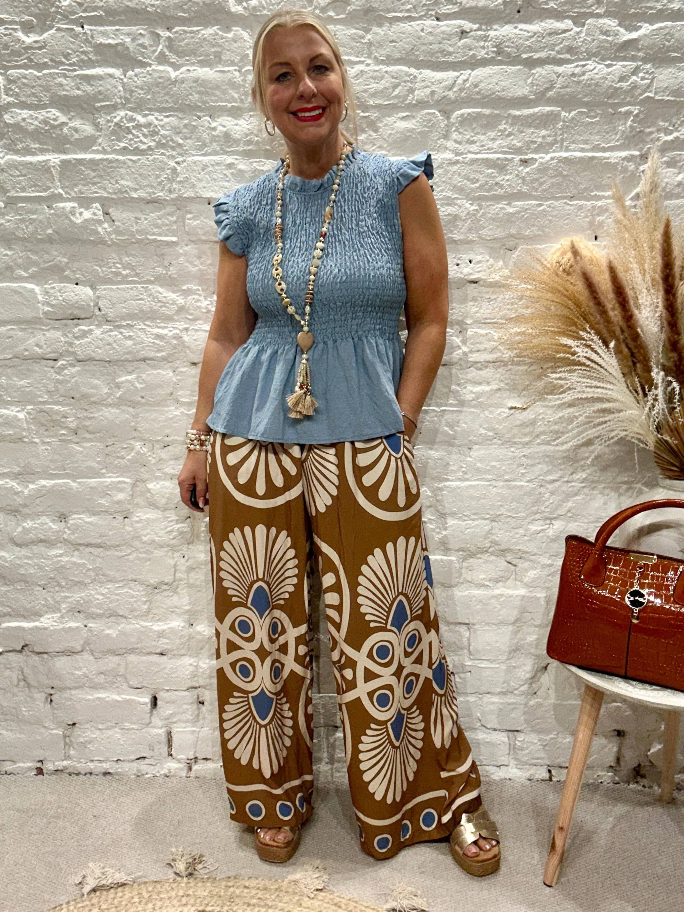 Romantica Sheering Peplum Top
