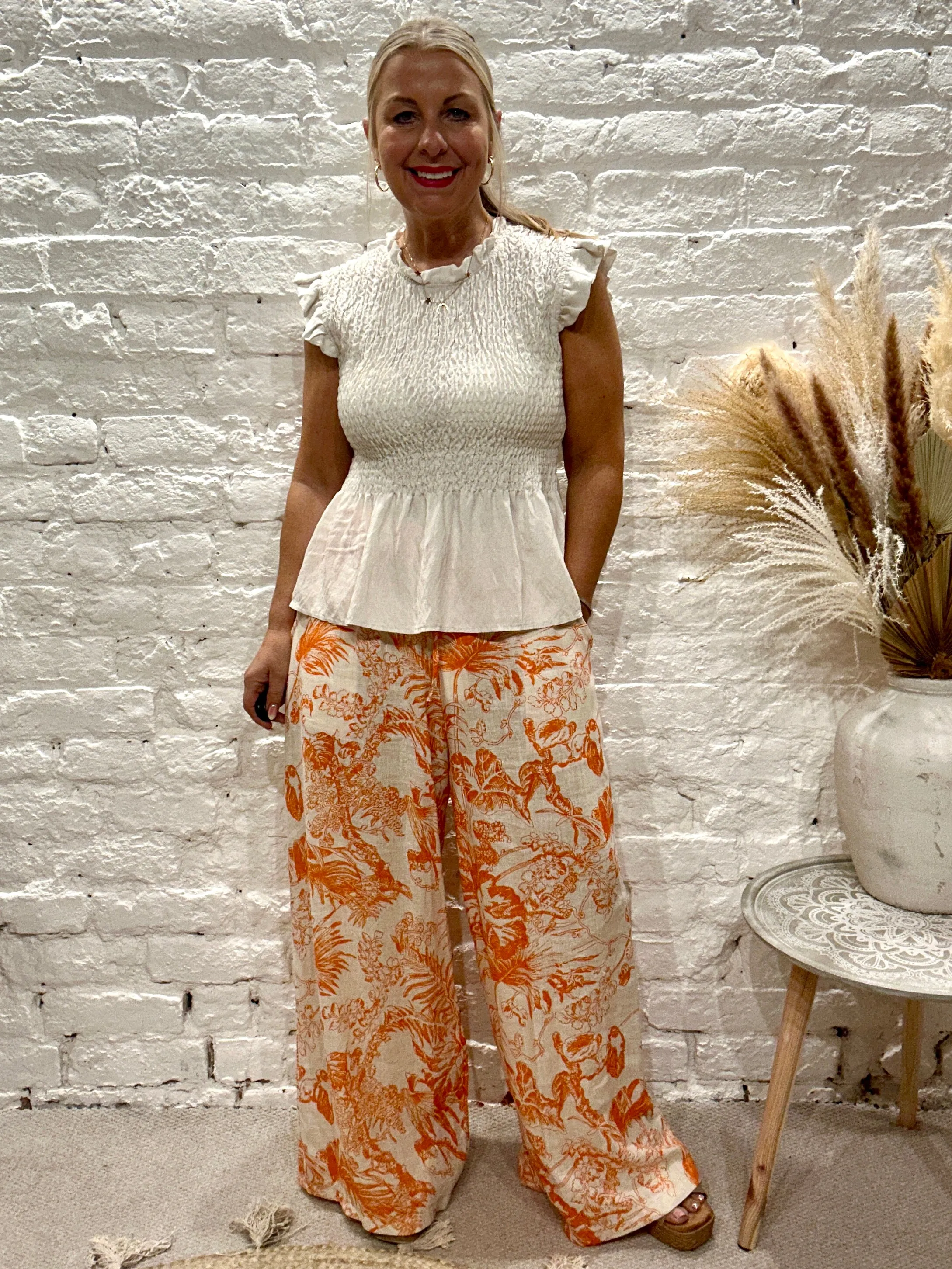 Romantica Sheering Peplum Top