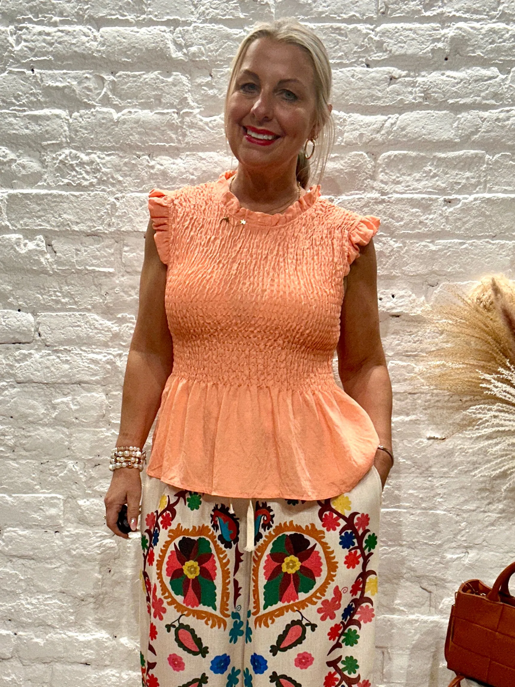Romantica Sheering Peplum Top